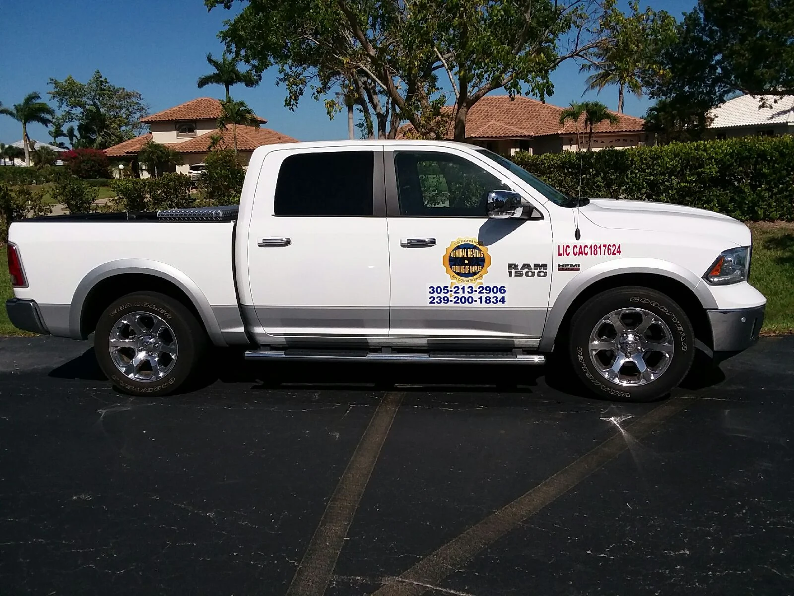 White Admiral Heating and Cooling of Naples Ram pickup with LIC CAC1817624 lettered in red beside the company emblem on the door